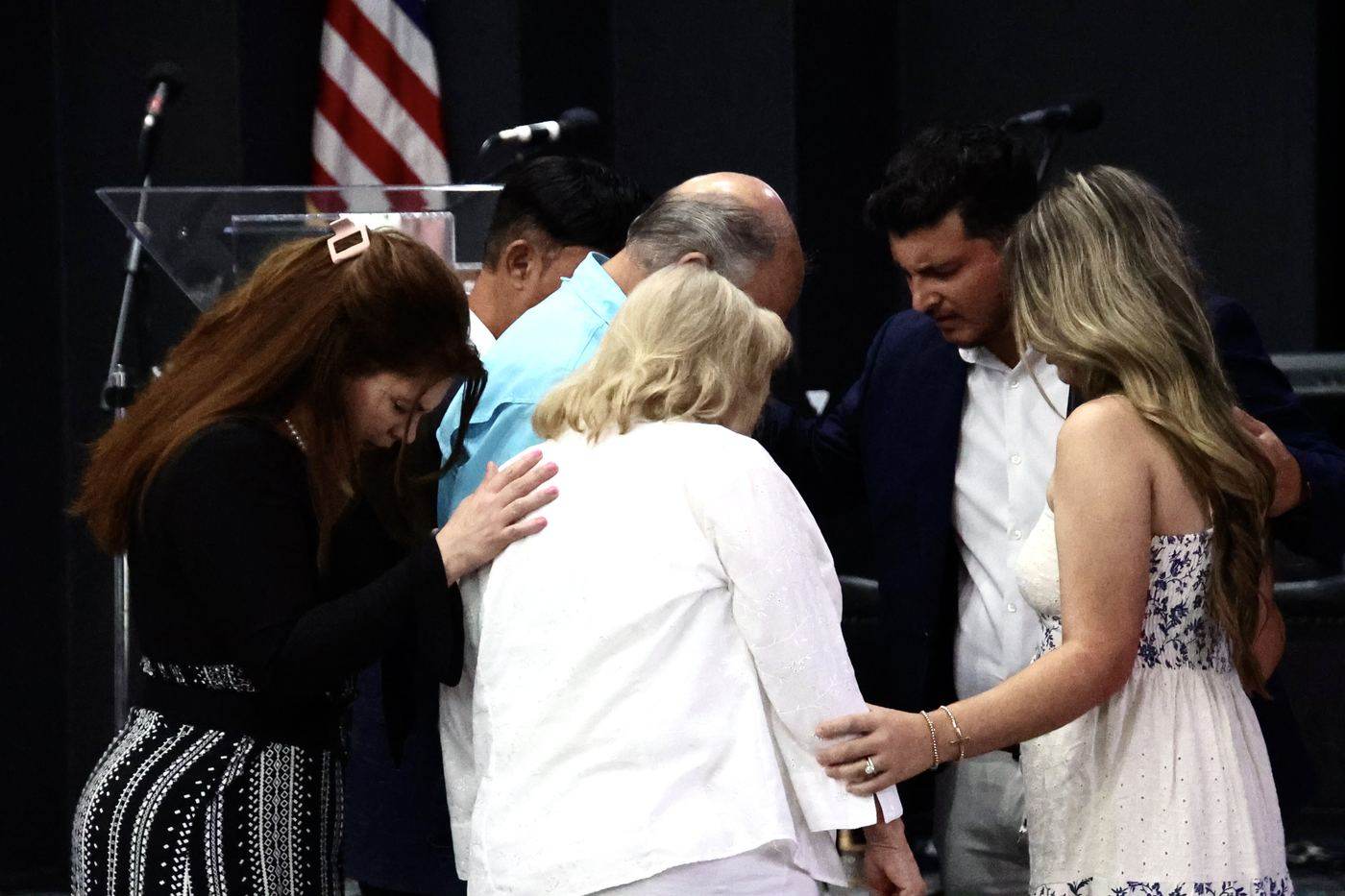 Members of the congregation in prayer together